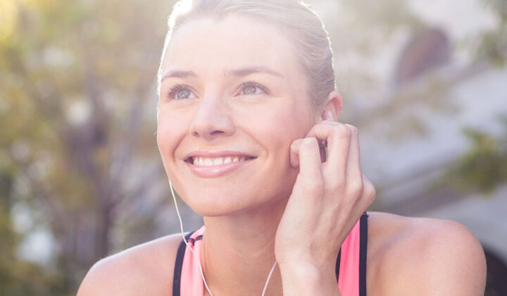 Smiling woman with earphones