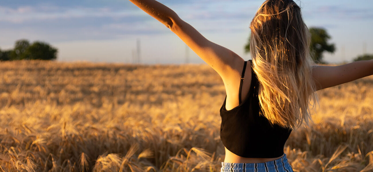 Woman posing in crop field