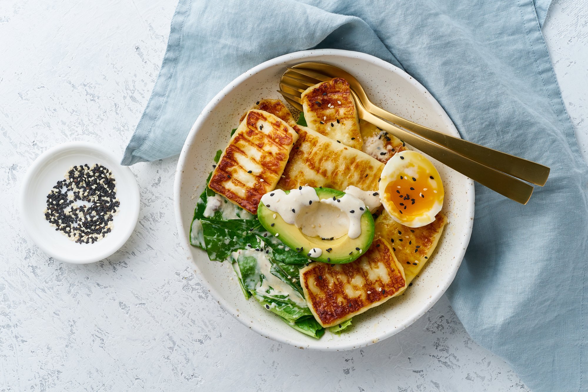 soft boiled eggs with grilled haloumi, avocado and lettuce