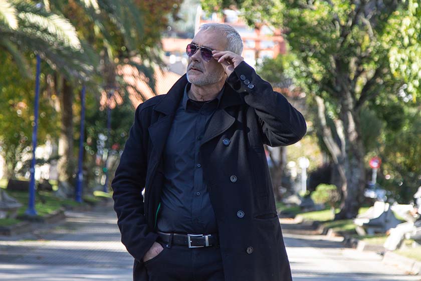 Man in shades and black coat