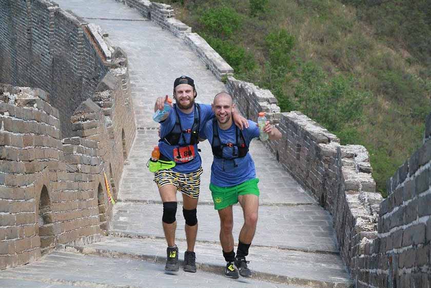 Runners posing on the Great Wall of China