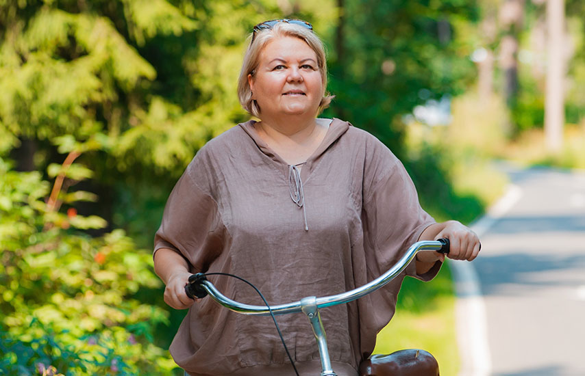Middle aged woman with bike
