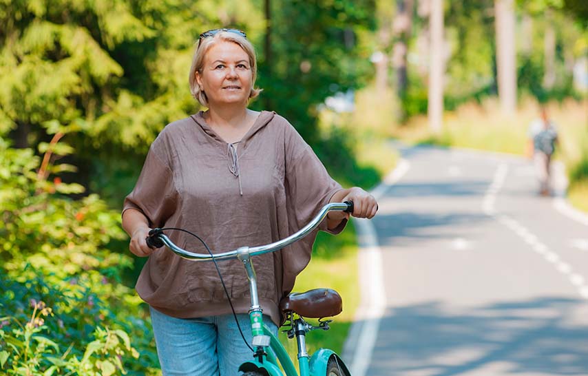 Middle aged woman with bike
