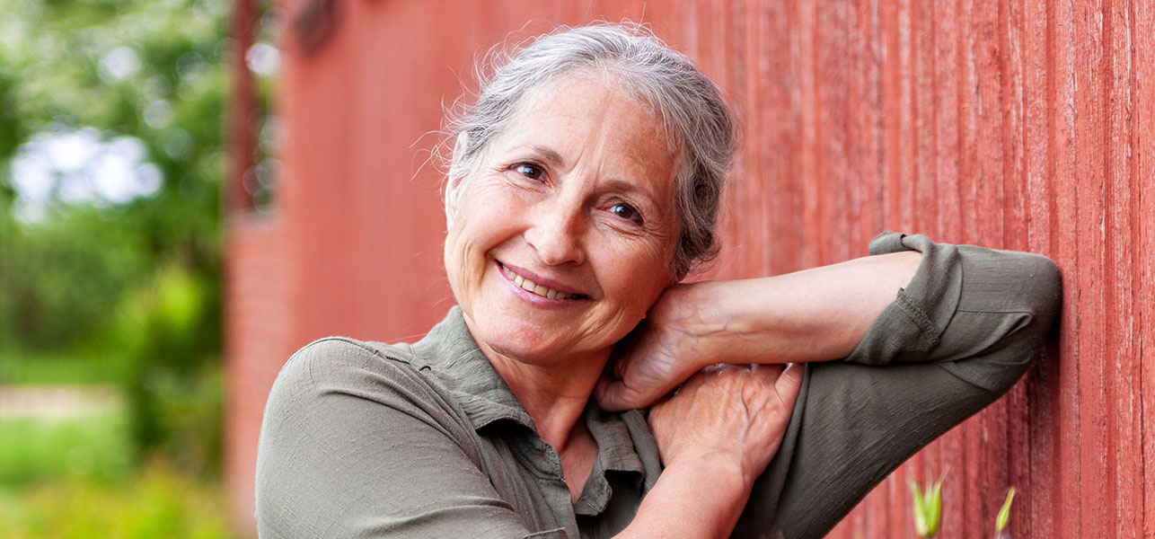 Smiling older woman in gray hair